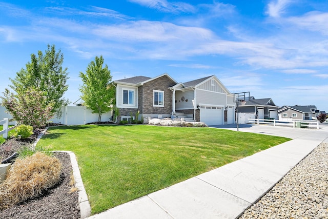 2515 W 3375 S, West Haven, UT 84401 - view of front of house with fence, stone siding, a garage, a front yard, and driveway