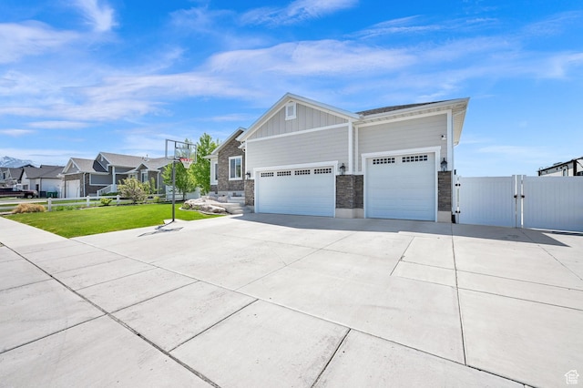 2515 W 3375 S, West Haven, UT 84401 - view of home's exterior with fence, board and batten siding, a gate, a lawn, and driveway