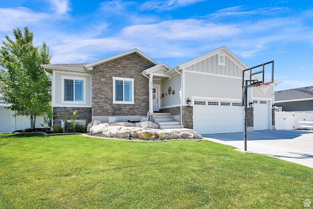 2515 W 3375 S, West Haven, UT 84401 - craftsman-style home featuring a front yard, driveway, an attached garage, and stone siding