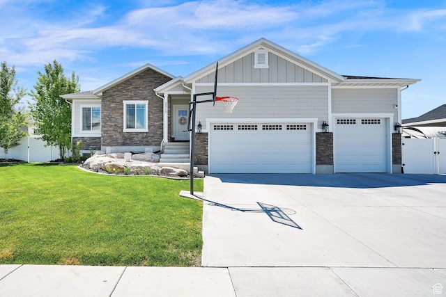 2515 W 3375 S, West Haven, UT 84401 - craftsman house featuring a garage, a front lawn, stone siding, board and batten siding, and driveway