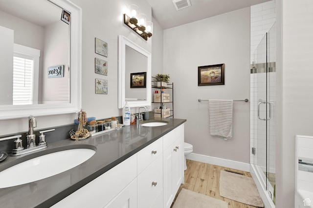 2515 W 3375 S, West Haven, UT 84401 - full bath featuring toilet, visible vents, a sink, and wood finished floors