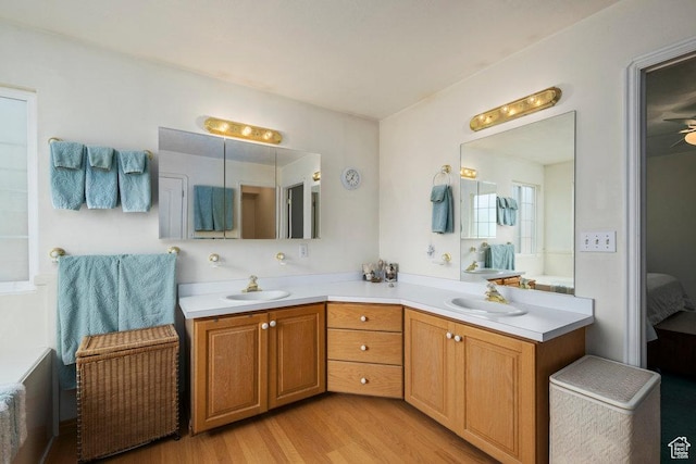 4851 E Lake Creek Rd, Heber City, UT 84032 - ensuite bathroom with a sink, double vanity, ensuite bath, and wood finished floors