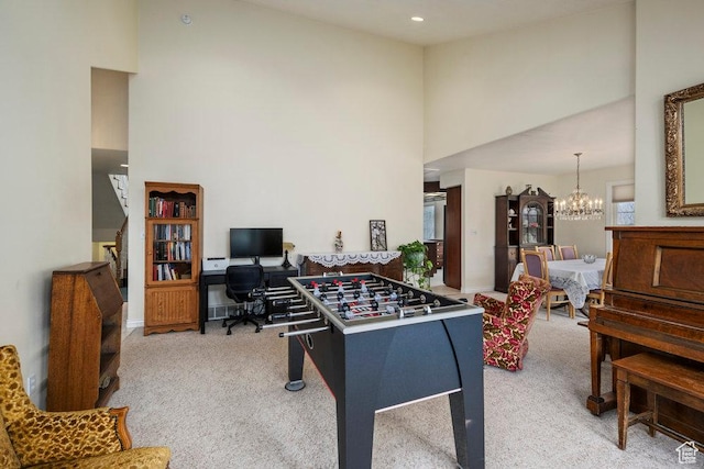 4851 E Lake Creek Rd, Heber City, UT 84032 - rec room with an inviting chandelier, carpet, a towering ceiling, and baseboards