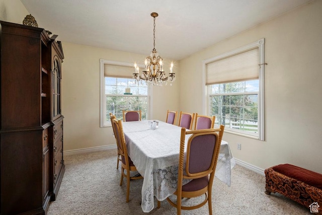 4851 E Lake Creek Rd, Heber City, UT 84032 - dining room featuring baseboards, a notable chandelier, and light carpet