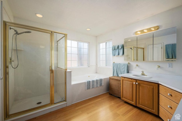 4851 E Lake Creek Rd, Heber City, UT 84032 - bathroom with vanity, wood finished floors, recessed lighting, a bath, and a shower stall
