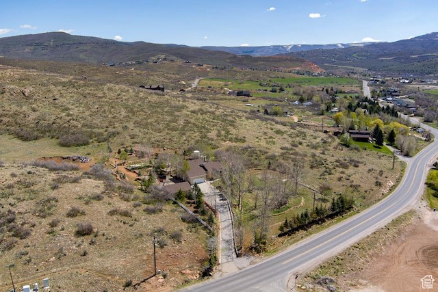 birds eye view of property featuring a mountain view