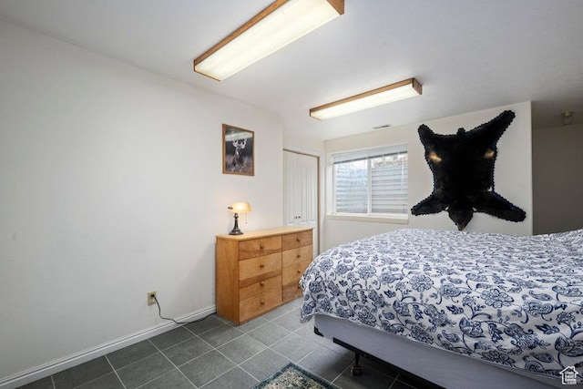 4851 E Lake Creek Rd, Heber City, UT 84032 - bedroom featuring dark tile patterned flooring, baseboards, a closet, and visible vents