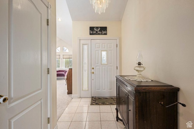 4851 E Lake Creek Rd, Heber City, UT 84032 - entryway featuring baseboards, a chandelier, light tile patterned flooring, and light carpet