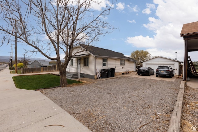 463 E Main St, Salina, UT 84654 - view of home's exterior featuring an outdoor structure, a garage, fence, driveway, and a yard