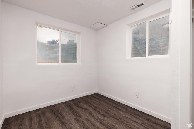 463 E Main St, Salina, UT 84654 - empty room with baseboards, dark wood finished floors, and a healthy amount of sunlight