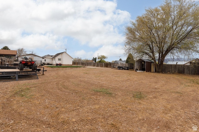 463 E Main St, Salina, UT 84654 - view of yard with a storage unit, a fenced backyard, a residential view, and an outdoor structure
