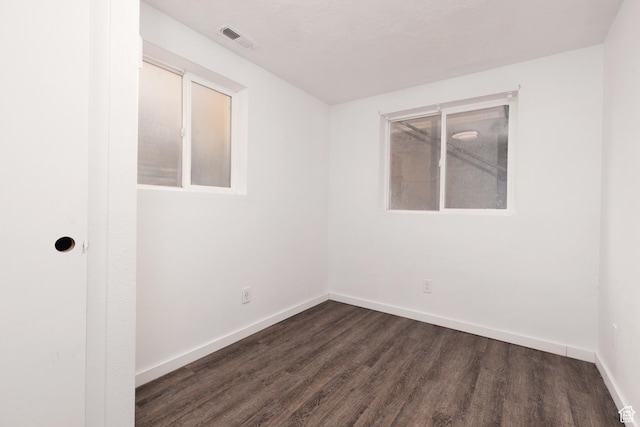 463 E Main St, Salina, UT 84654 - spare room featuring visible vents, dark wood-style flooring, and baseboards