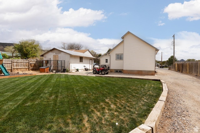 463 E Main St, Salina, UT 84654 - rear view of property with a playground, fence, and a yard