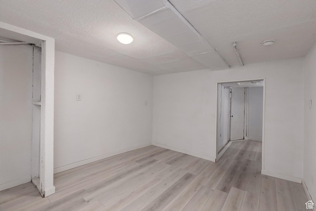 463 E Main St, Salina, UT 84654 - spare room featuring baseboards, light wood-type flooring, and a textured ceiling