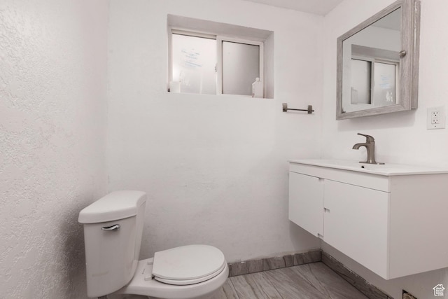 463 E Main St, Salina, UT 84654 - bathroom featuring baseboards, vanity, and toilet