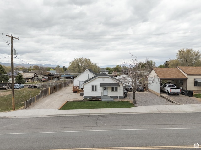 463 E Main St, Salina, UT 84654 - bungalow-style house with fence, a front lawn, entry steps, and gravel driveway