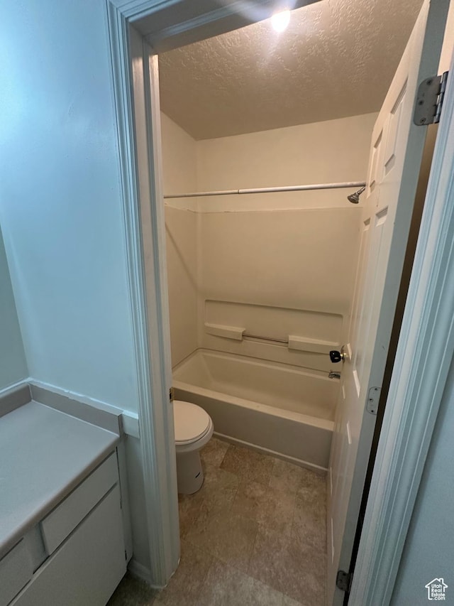 558 N Redwood Rd Unit 2-4, Salt Lake City, UT 84116 - full bath featuring a textured ceiling, bathing tub / shower combination, and toilet