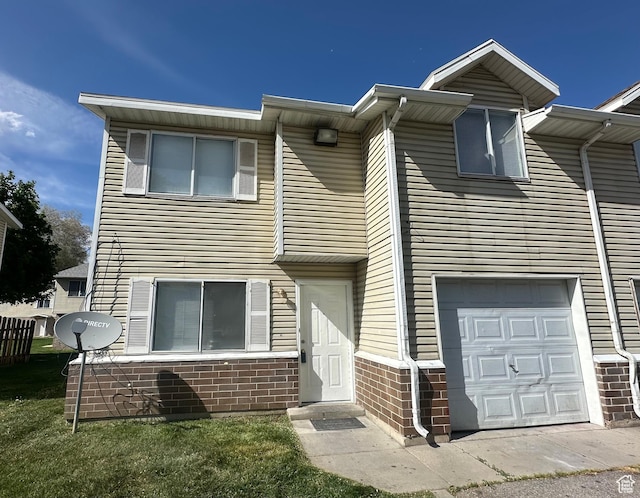558 N Redwood Rd Unit 2-4, Salt Lake City, UT 84116 - townhome / multi-family property with a garage and brick siding