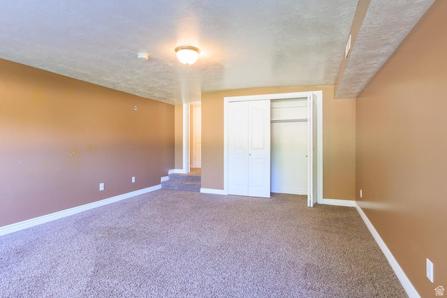 724 E 3230 N, Provo, UT 84604 - unfurnished bedroom featuring carpet floors, baseboards, a closet, and a textured ceiling