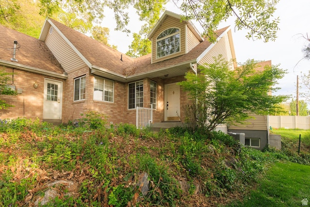 724 E 3230 N, Provo, UT 84604 - exterior space featuring brick siding, roof with shingles, and fence