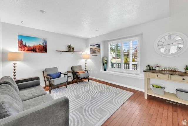 267 W 1600 N, Layton, UT 84041 - living room featuring baseboards, a textured ceiling, hardwood / wood-style floors, and visible vents