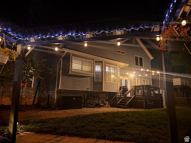 267 W 1600 N, Layton, UT 84041 - back of house at twilight with a lawn, stairs, and a deck