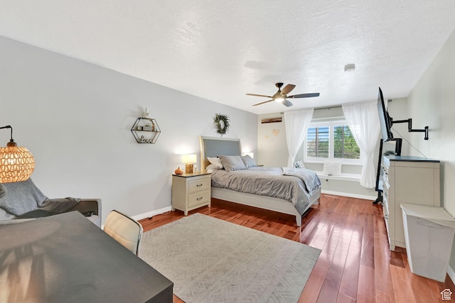267 W 1600 N, Layton, UT 84041 - bedroom featuring baseboards, wood-type flooring, a ceiling fan, and a textured ceiling