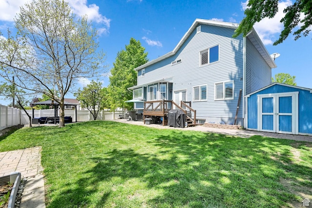 267 W 1600 N, Layton, UT 84041 - back of house with a patio area, an outdoor structure, a fenced backyard, a storage unit, and a yard