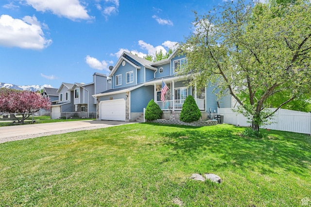 267 W 1600 N, Layton, UT 84041 - view of front of property featuring an attached garage, fence, a front yard, a porch, and driveway
