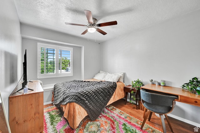 267 W 1600 N, Layton, UT 84041 - bedroom featuring baseboards, a ceiling fan, a textured ceiling, and wood finished floors