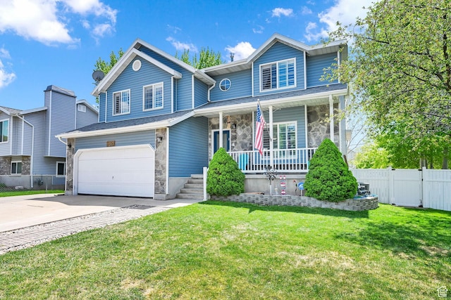 267 W 1600 N, Layton, UT 84041 - traditional-style home featuring a porch, driveway, a garage, fence, and a front lawn