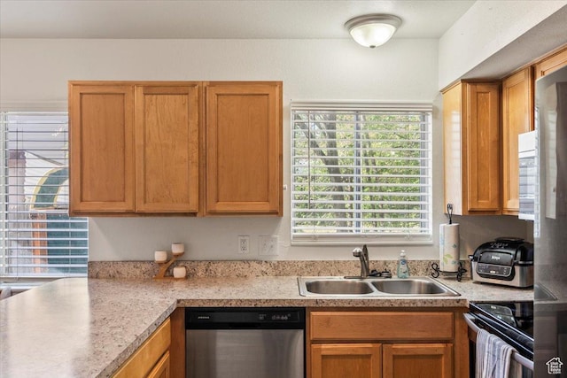 kitchen featuring a sink, light countertops, black electric range oven, and stainless steel dishwasher