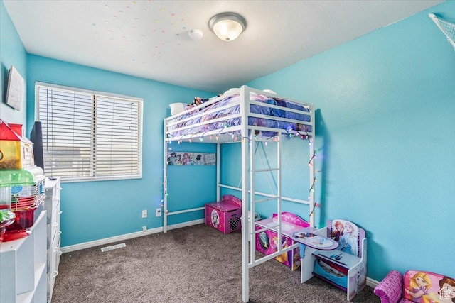 carpeted bedroom with baseboards and visible vents