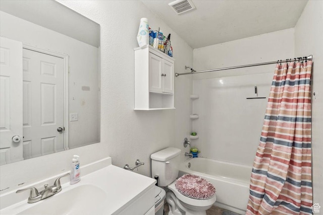 bathroom with shower / tub combo with curtain, vanity, toilet, and visible vents