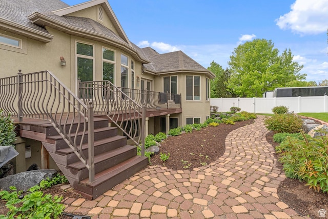 359 E 680 N, Lindon, UT 84042 - rear view of house featuring stucco siding, fence, a deck, stairs, and a shingled roof