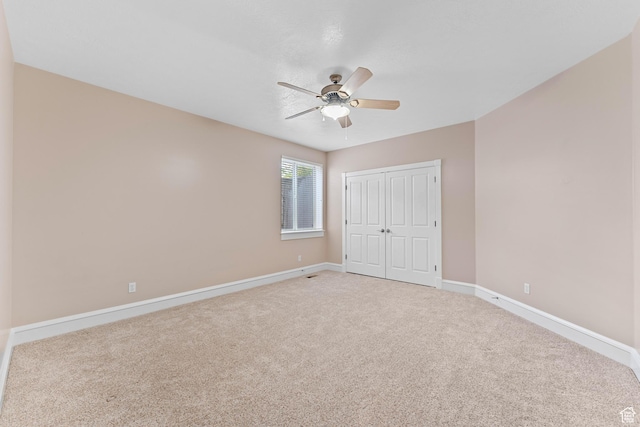 359 E 680 N, Lindon, UT 84042 - unfurnished bedroom with light carpet, baseboards, a closet, and a ceiling fan