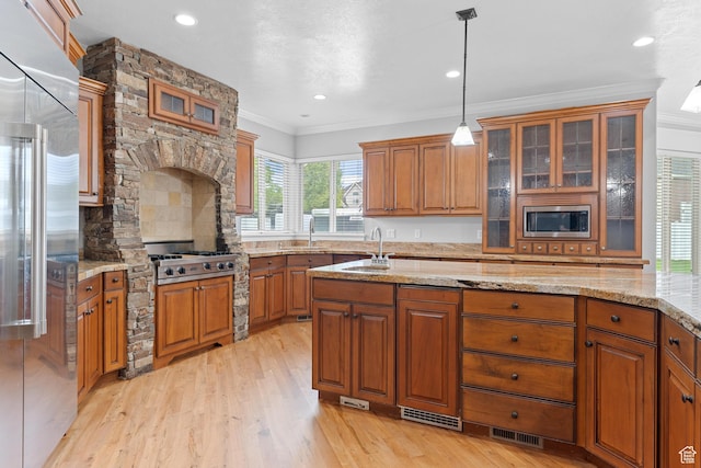 359 E 680 N, Lindon, UT 84042 - kitchen featuring built in appliances, brown cabinets, a sink, crown molding, and light wood-style floors