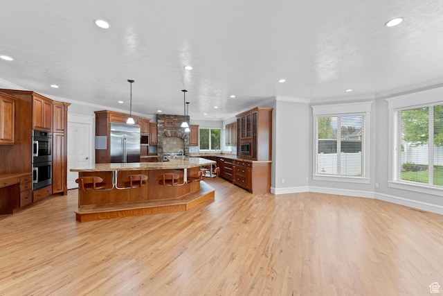 359 E 680 N, Lindon, UT 84042 - kitchen with stainless steel appliances, a large island, plenty of natural light, recessed lighting, and light wood finished floors