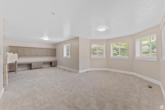 359 E 680 N, Lindon, UT 84042 - unfurnished living room with baseboards, plenty of natural light, and light colored carpet
