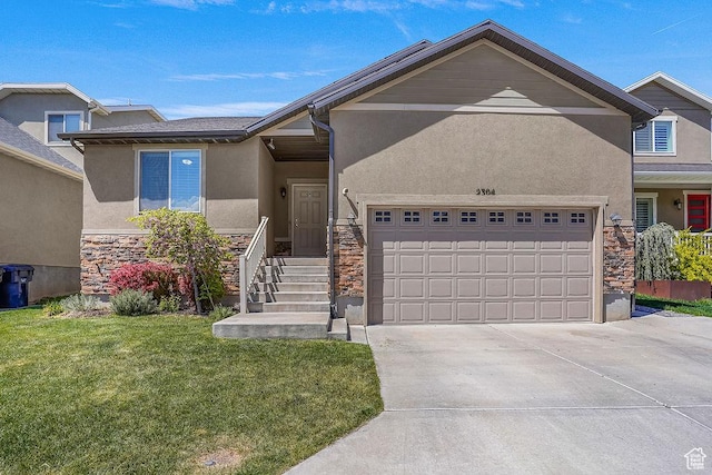 view of front of property featuring a front lawn, stone siding, a garage, stucco siding, and driveway
