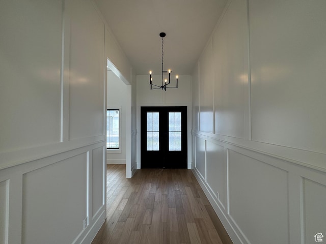5269 W 2040 S, Hurricane, UT 84737 - doorway featuring wood-type flooring, a decorative wall, and a notable chandelier