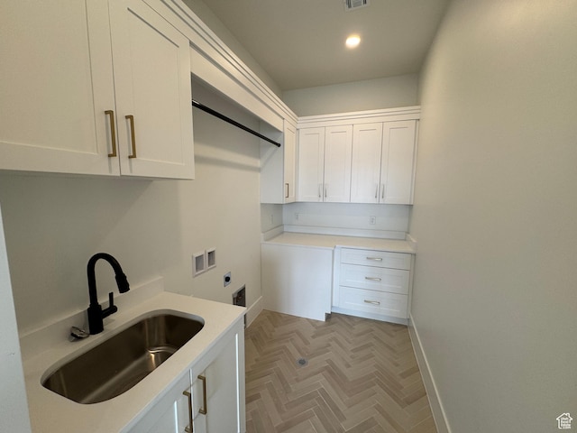 5269 W 2040 S, Hurricane, UT 84737 - laundry room with cabinet space, a sink, hookup for a washing machine, electric dryer hookup, and baseboards