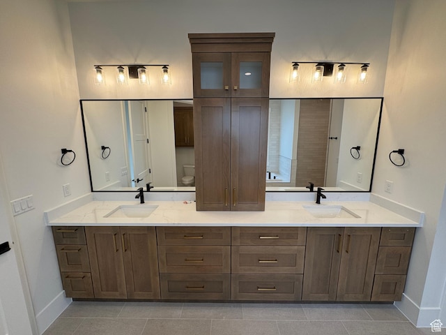 5269 W 2040 S, Hurricane, UT 84737 - bathroom with a sink, baseboards, and tile patterned flooring