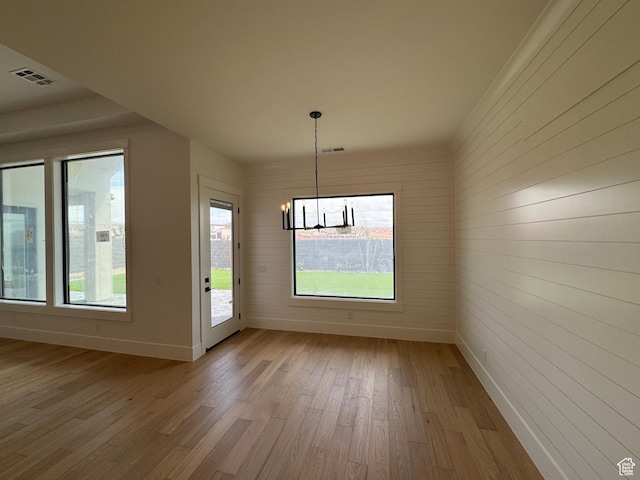 5269 W 2040 S, Hurricane, UT 84737 - unfurnished dining area featuring baseboards, visible vents, light wood-type flooring, and a notable chandelier