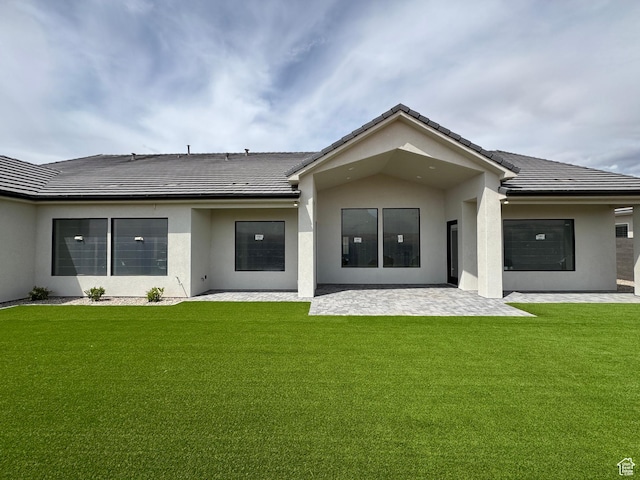 5269 W 2040 S, Hurricane, UT 84737 - back of property with a lawn, a tiled roof, a patio area, and stucco siding