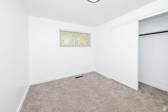 4432 Orchard Ave, South Ogden, UT 84403 - unfurnished bedroom with a closet, baseboards, and carpet flooring