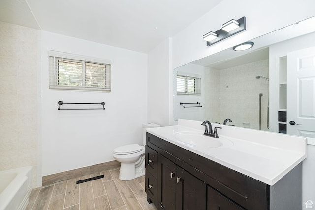 4432 Orchard Ave, South Ogden, UT 84403 - full bathroom featuring wood finish floors, vanity, toilet, shower / bathing tub combination, and visible vents