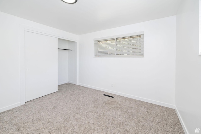 4432 Orchard Ave, South Ogden, UT 84403 - unfurnished bedroom featuring a closet, carpet flooring, baseboards, and visible vents