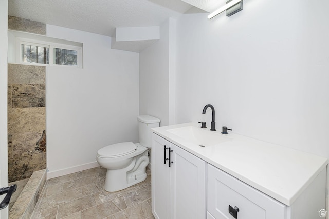 4432 Orchard Ave, South Ogden, UT 84403 - full bath with a textured ceiling, baseboards, vanity, toilet, and tiled shower