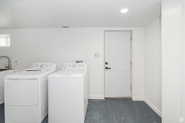 4432 Orchard Ave, South Ogden, UT 84403 - clothes washing area with washing machine and clothes dryer, laundry area, a textured ceiling, baseboards, and visible vents